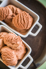 Chocolate ice cream balls close up and copy space