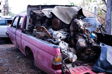 Parts of used cars sitting in junkyard