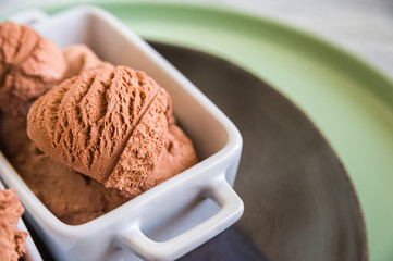 Chocolate ice cream balls close up and copy space