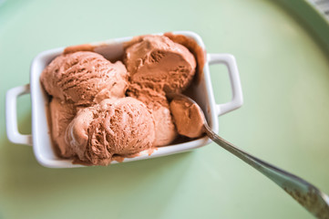 Chocolate ice cream balls close up and copy space