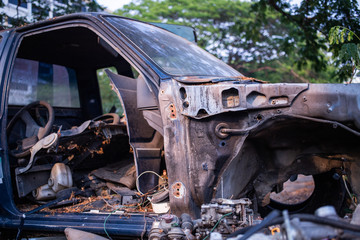 Parts of used cars sitting in junkyard