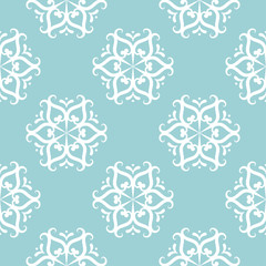 Floral seamless pattern. White on blue. Textile background