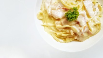 Spaghetti cabonara on white dish background