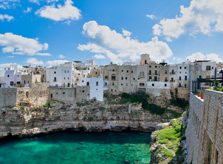 Amazing coastline of Polignano a Mare, Italy. Beach and beautiful summer sky