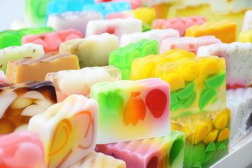 Different kinds of handmade natural soap on white background. Handmade colorful organic soap, spa, beauty skincare concept.