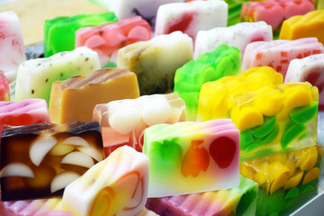 Different kinds of handmade natural soap on white background. Handmade colorful organic soap, spa, beauty skincare concept.