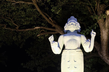 sculpture of a hindu deity with four arms and several faces