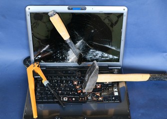 laptop keyboard and monitor broken with a hammer