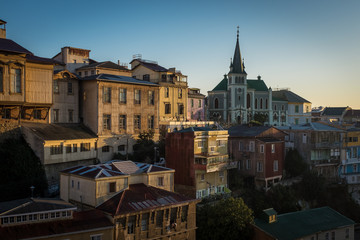 A sweeping view of the colourful streets of the city of Valparaiso, Chile at sunset