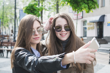 friendship concept two girls taking selfie in the city