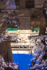 building reflected in a puddle