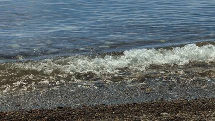 sailboats on the horizon are sailing on the blue sea