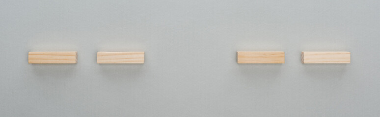 panoramic shot of wooden bricks isolated on grey