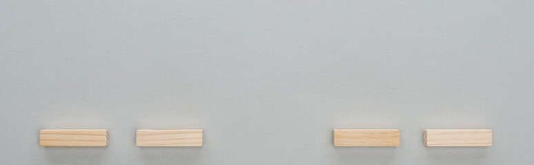panoramic shot of wooden blocks isolated on grey with copy space