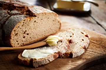Buttered slice of freshly bake rye bread