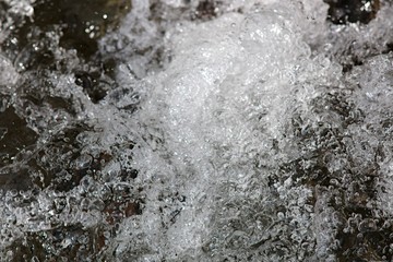Air bubbles in fast flowing water stream