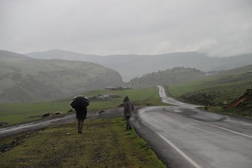 Rainy day - young man with umbrella 