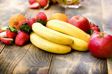 Fresh organic fruit, healthy vegetarian food on rustic table