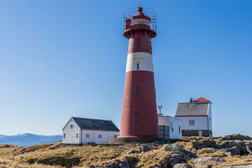 Fototapeta na wymiar Grasoyane Lighthouse with blue skye at Ulsteinvik, Norway 15 april 2019