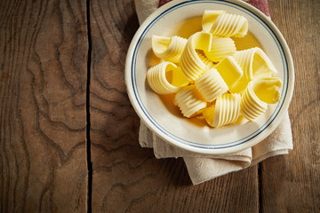 Bowl of decorative curls of farm fresh butter