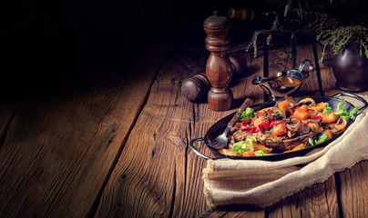 tender beef topped with various vegetables