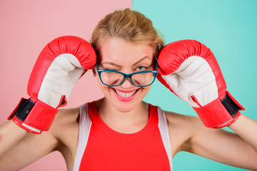 Woman boxing gloves adjust eyeglasses. Win with strength or intellect. Strong intellect victory pledge. Know how defend myself. Confident her power. Strong mentally and physically. Smart and strong