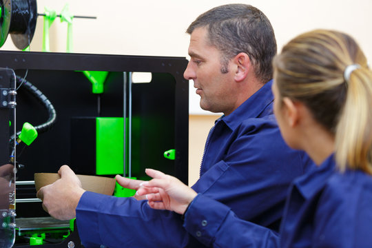 portrait of man and woman in modern design studio
