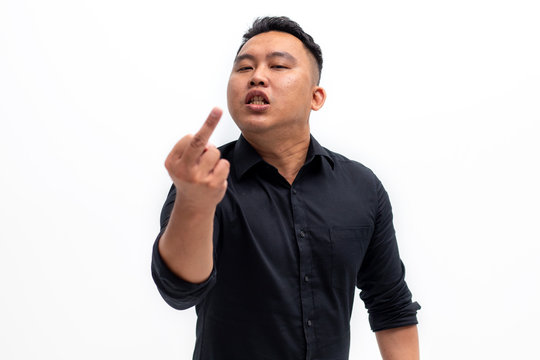 Rude man displeased about something and showing the middle finger.
