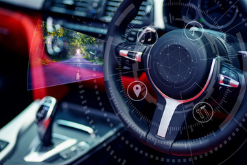 Double exposure in street view with  Digital image of car steering wheel with icons ,Car in autopilot mode hands free,blue tone.