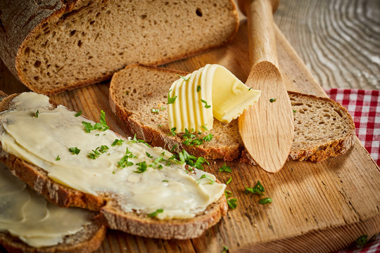 Buttered slices of fresh rye bread with parsley