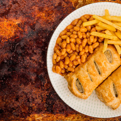 Sausage Rolls with Baked Beans and Chips