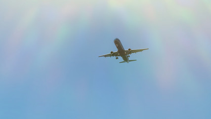 Airplane is flying in blue sky. Passenger aircraft. Concept of travel and business. Copy space