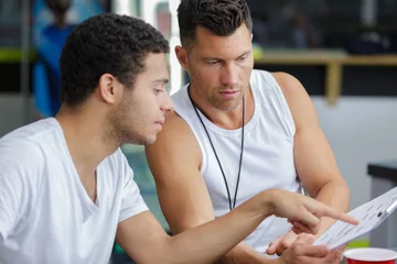 Fotobehang Persoonlijk man with personal trainer  © auremar