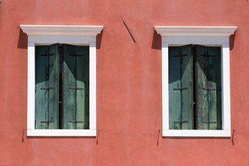 Windows with traditional shutters Venice Italy