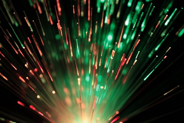 Bundle of optic fibers in red and green light