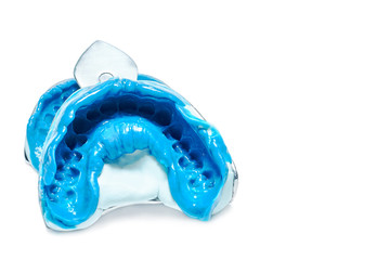 Two dental impressions on a white background with copy space. The imprint of the tooth row of high precision.