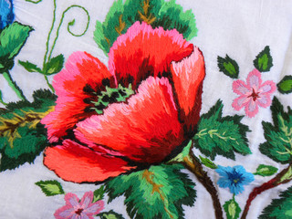 embroidered red poppy flower isolated on white background, decor element, Ukrainian folk embroidery
