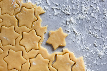The process of baking cookies at home. Cookie dough. Star-shaped cookies, pryanik. view from above