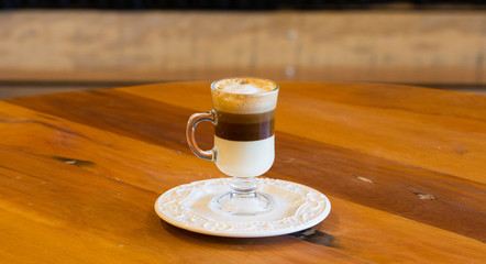 cup of coffee on wooden table