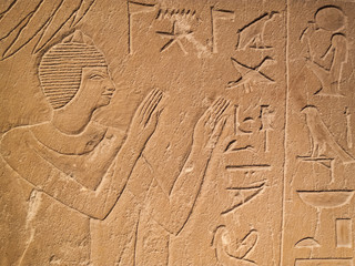 Ancient Egypt tomb hieroglyphs stone wall background