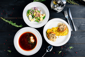 Enjoy your meal. Set of three delicious dishes served on a restaurant table