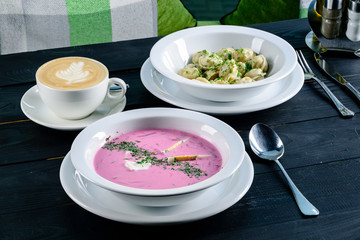 Two plates with the meal on the table, view from above