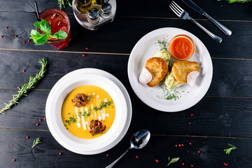 Two plates with the meal on the table, view from above