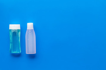 mycelial water, lotion for skin care on blue background flat lay space for text