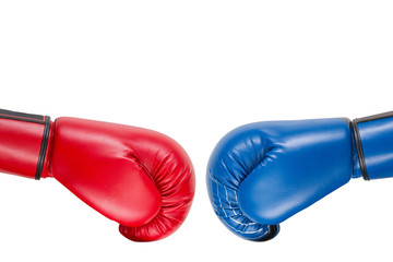 blue and red boxing gloves are moving at each other for a kick, business concept and destruction, on a white background, isolate