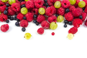 Various fresh summer berries on a white background. Top view