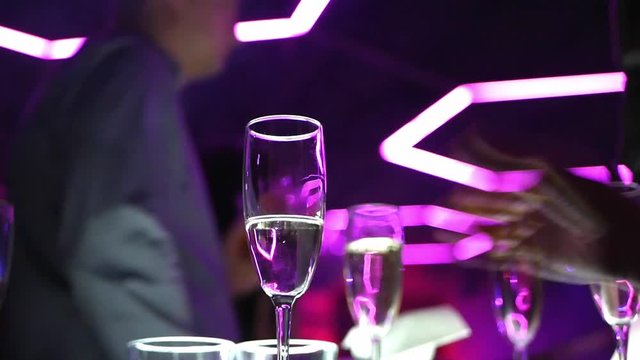 Glasses of champagne on a table close-up in a nightclub