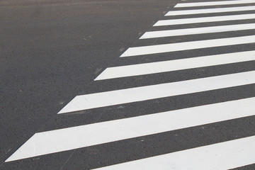 White . line on city asphalt road background. pedestrian crossing. Copy space for text.
