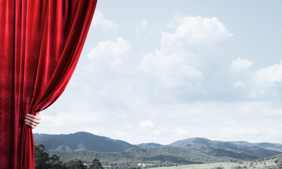 Summer natural bluesky view behind red velvet curtain