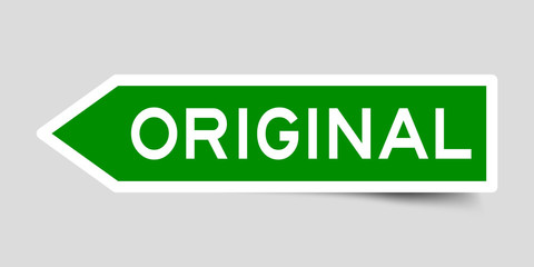Green color arrow label sticker with word original on gray background